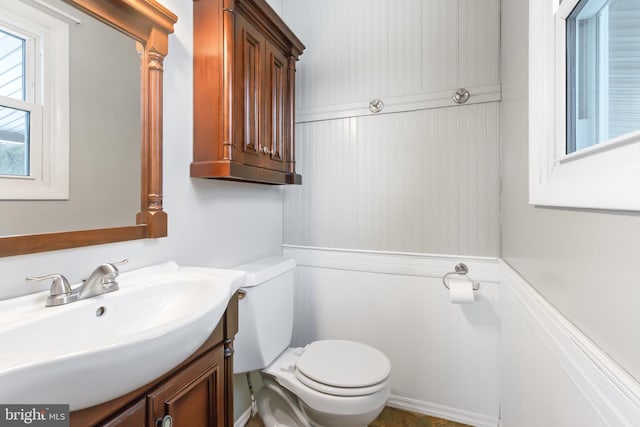 bathroom featuring vanity and toilet