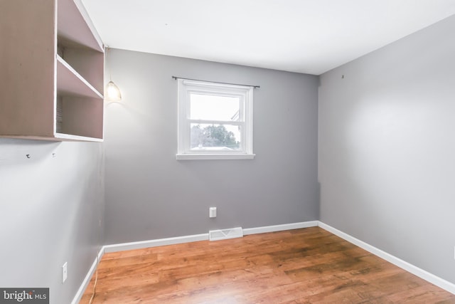 empty room featuring hardwood / wood-style floors