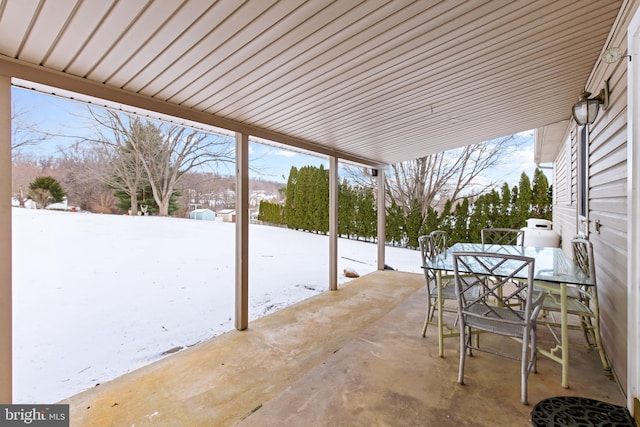 view of snow covered patio