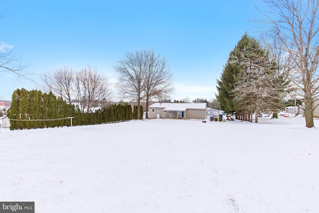 view of yard layered in snow