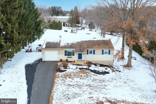 single story home with a garage