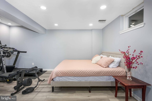 bedroom with light hardwood / wood-style flooring