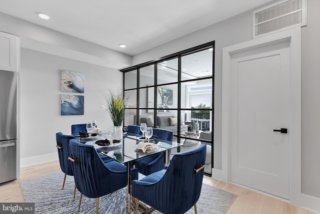 dining room with light hardwood / wood-style floors