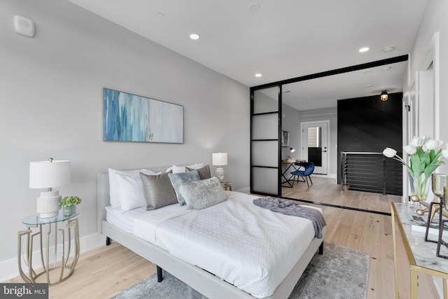 bedroom with light wood-type flooring