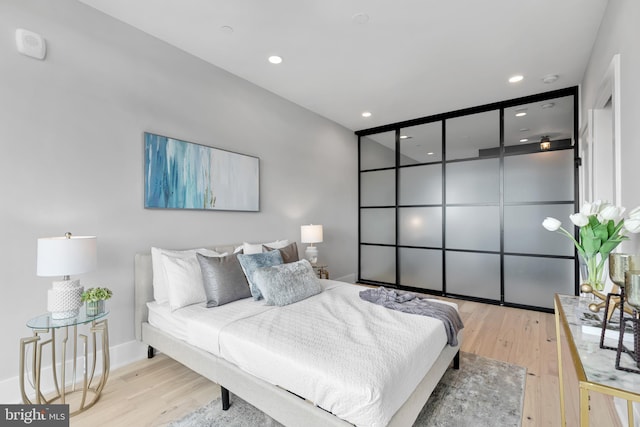 bedroom with light hardwood / wood-style flooring