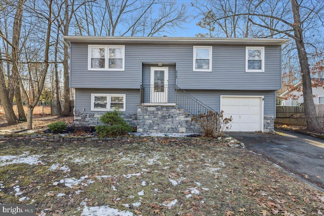 split foyer home featuring a garage