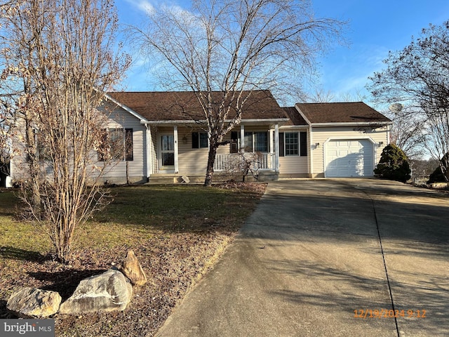 ranch-style home with a garage and a front lawn