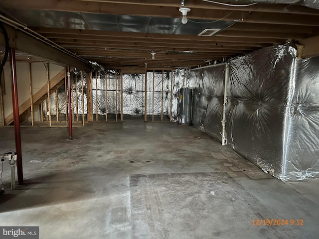 basement featuring water heater