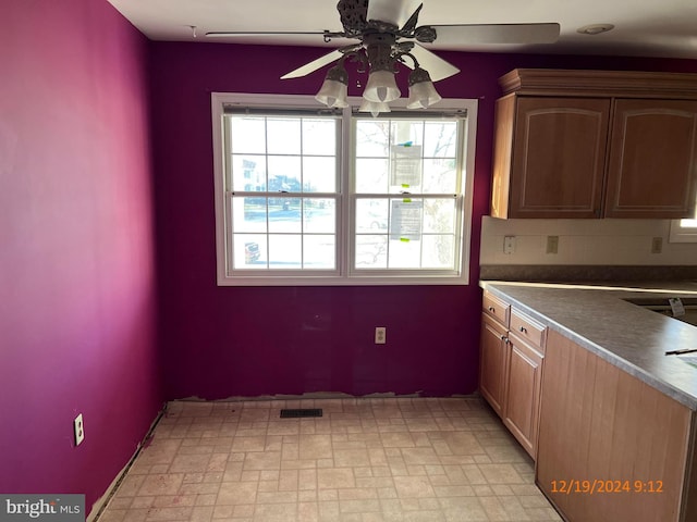 kitchen featuring tasteful backsplash and ceiling fan