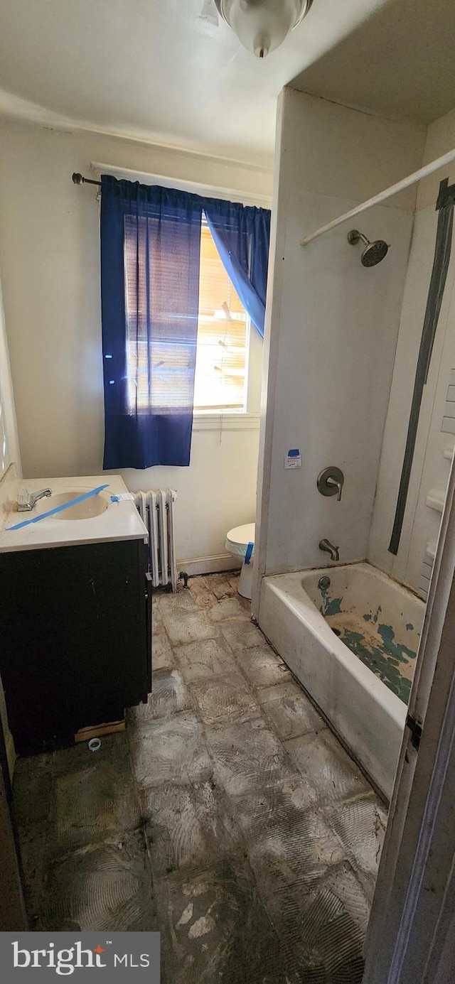 full bathroom featuring bathtub / shower combination, radiator heating unit, vanity, and toilet
