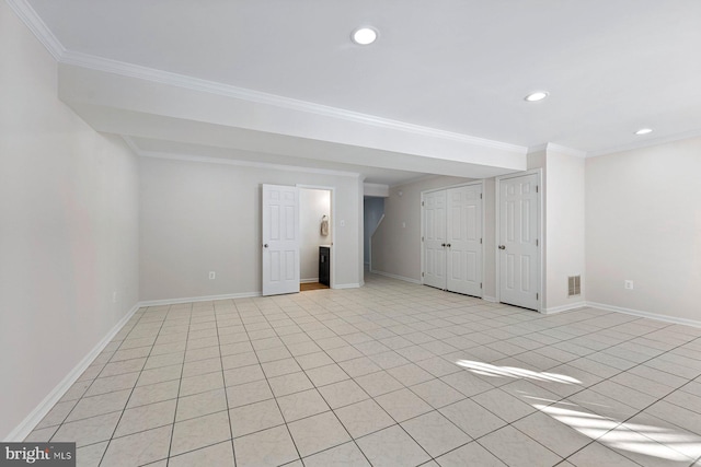 basement featuring crown molding and light tile patterned flooring