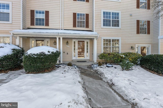 view of snow covered property entrance