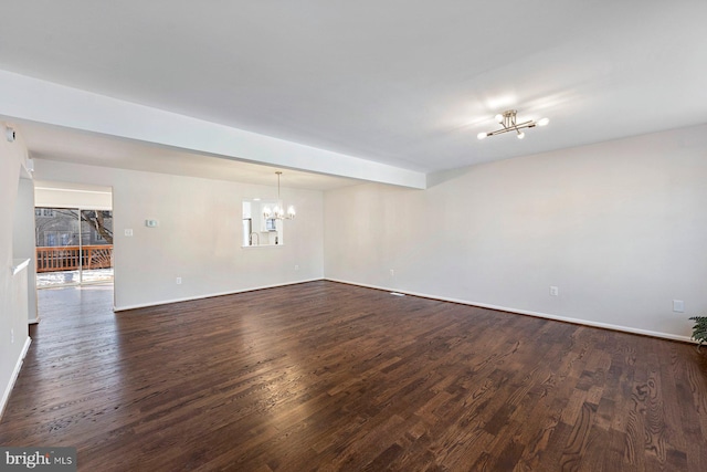 unfurnished room with dark wood-type flooring, beam ceiling, a chandelier, and a healthy amount of sunlight