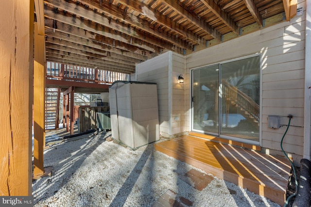 miscellaneous room featuring wood-type flooring, wooden ceiling, wooden walls, and beam ceiling