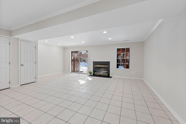 unfurnished living room with ornamental molding and light tile patterned floors