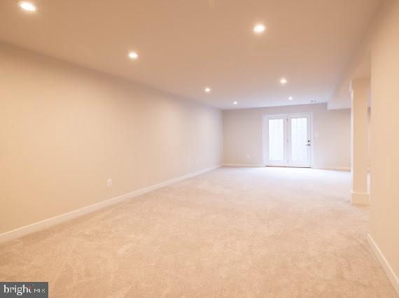 unfurnished room with light carpet