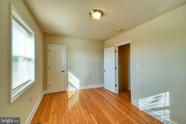 spare room featuring light hardwood / wood-style floors