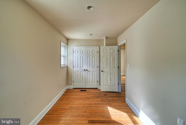 unfurnished bedroom with light hardwood / wood-style floors