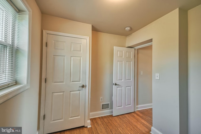 unfurnished bedroom featuring light wood-type flooring