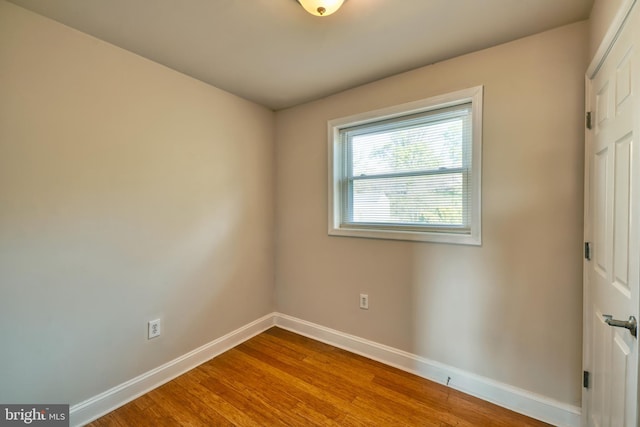 empty room featuring hardwood / wood-style floors