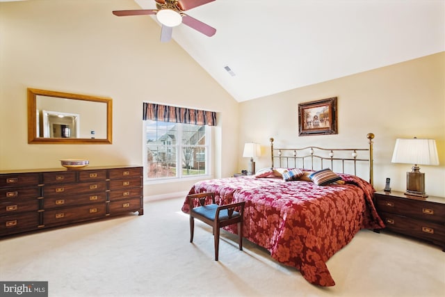 bedroom with ceiling fan, high vaulted ceiling, and light carpet