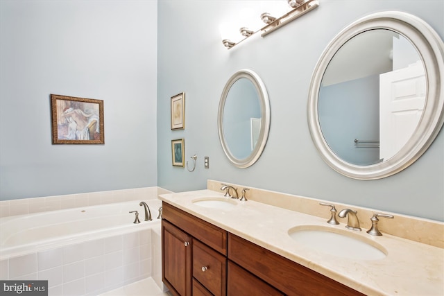 bathroom with vanity and a relaxing tiled tub