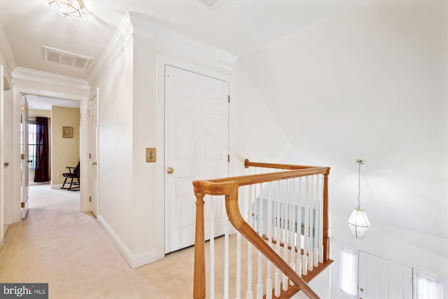 corridor with light colored carpet, crown molding, and vaulted ceiling