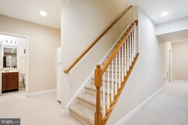 staircase with carpet floors