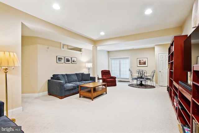 living room featuring light carpet