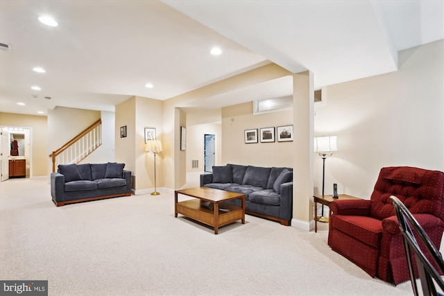 living room featuring light carpet