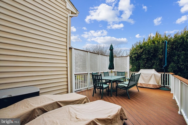 wooden deck featuring area for grilling