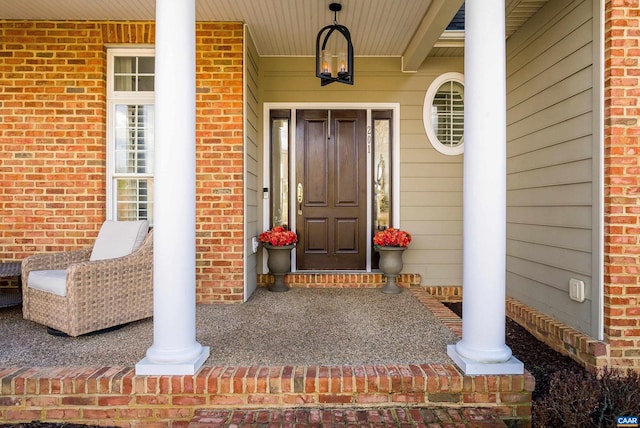 doorway to property with a porch