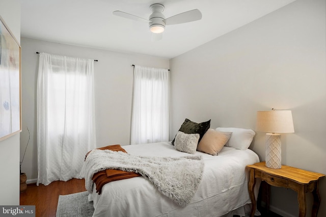 bedroom with ceiling fan and hardwood / wood-style floors