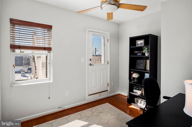 home office featuring ceiling fan and hardwood / wood-style flooring