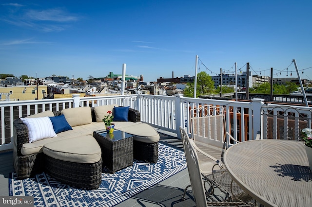 wooden terrace featuring outdoor lounge area