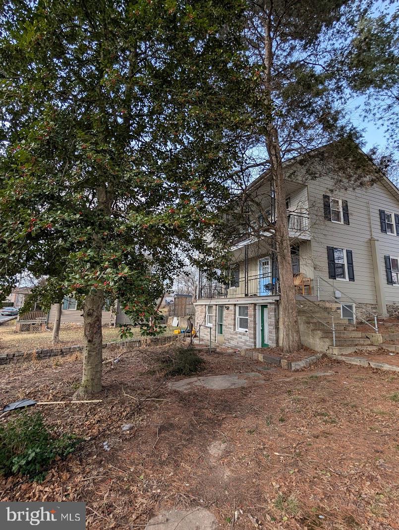 rear view of house with a balcony