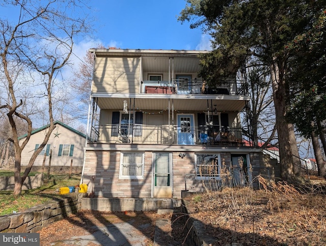 view of front of property with a balcony