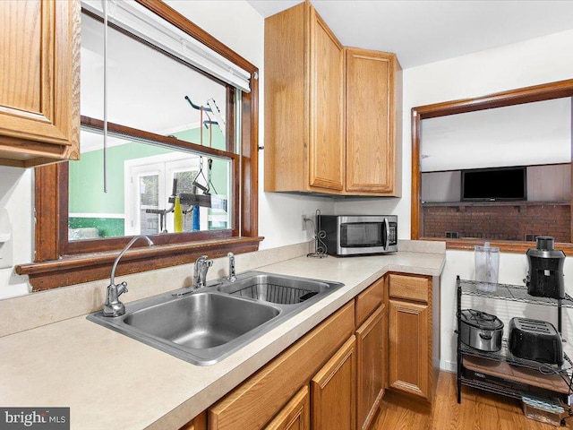 kitchen featuring light hardwood / wood-style flooring and sink