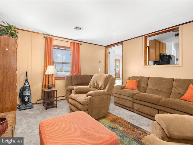 carpeted living room featuring crown molding