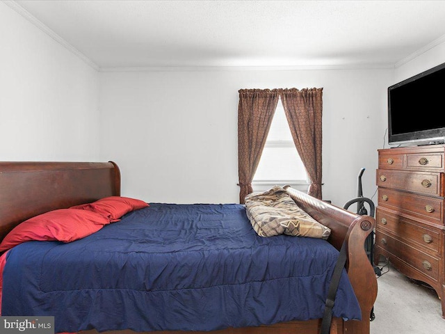 carpeted bedroom featuring ornamental molding