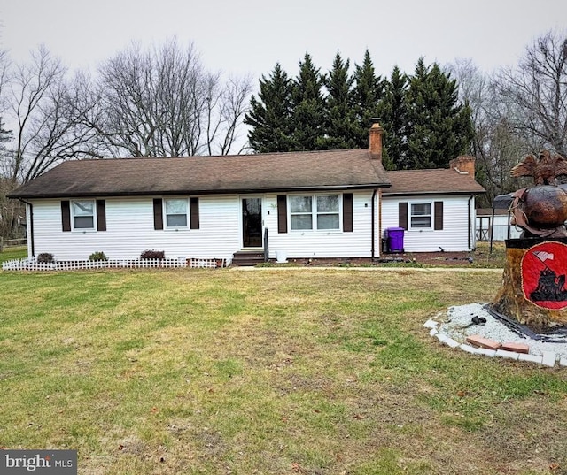 ranch-style house with a front lawn