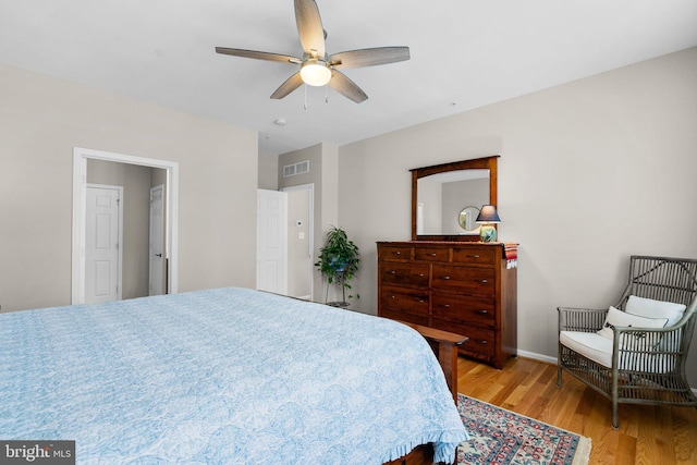 bedroom featuring light hardwood / wood-style floors and ceiling fan