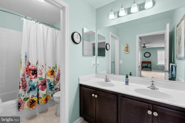 full bathroom featuring ceiling fan, toilet, vanity, and shower / tub combo