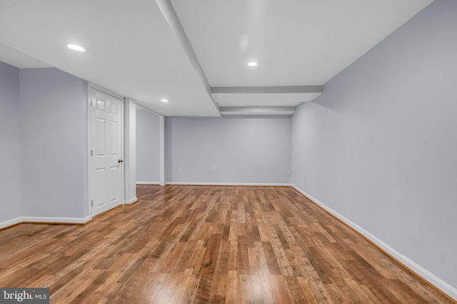 basement with hardwood / wood-style floors