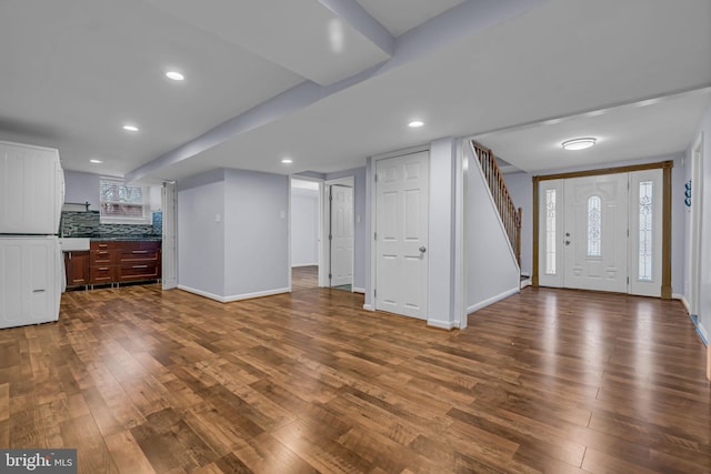 foyer entrance with dark wood-type flooring