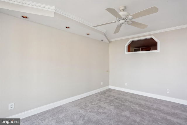 unfurnished room featuring ornamental molding, ceiling fan, and carpet