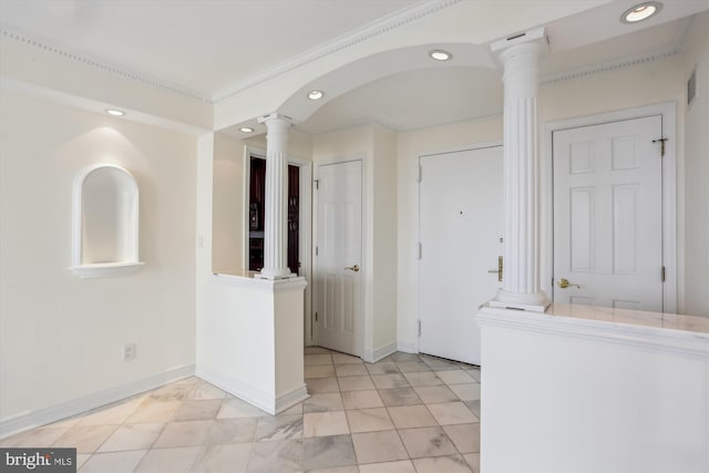 interior space with ornate columns and ornamental molding