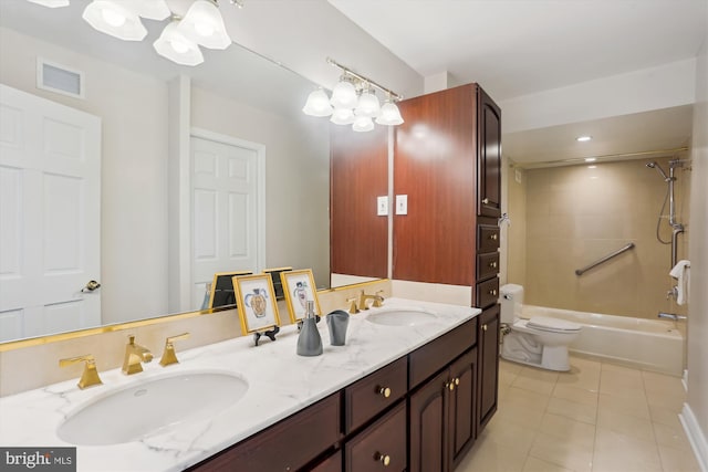 full bathroom with a chandelier, tiled shower / bath combo, vanity, toilet, and tile patterned floors