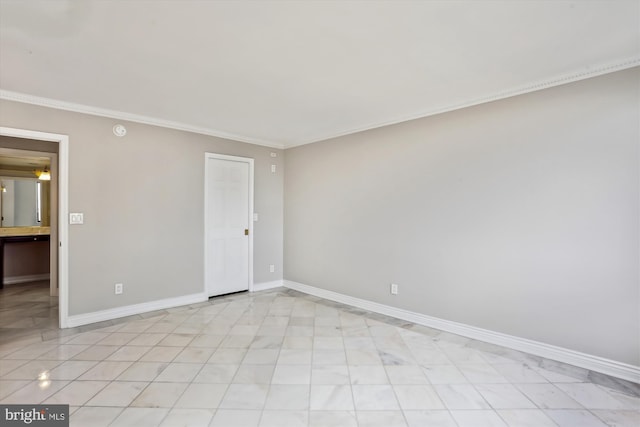 unfurnished room with crown molding