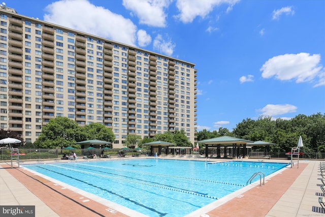 view of swimming pool featuring a gazebo and a patio